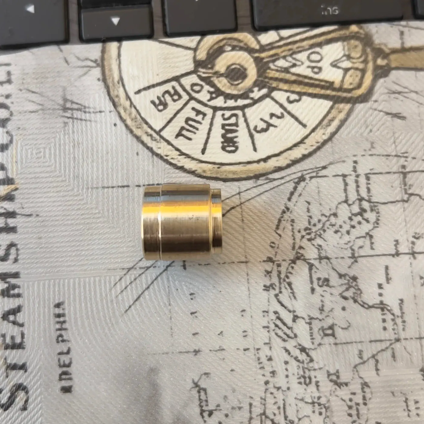 Side view of a machined R.N. brass macaroni insert